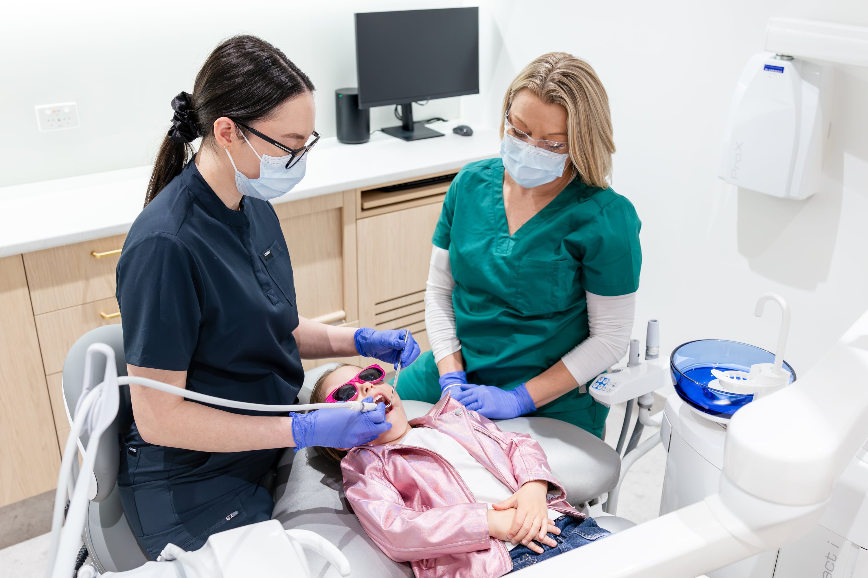 Child and parent smiling after a gentle dental visit