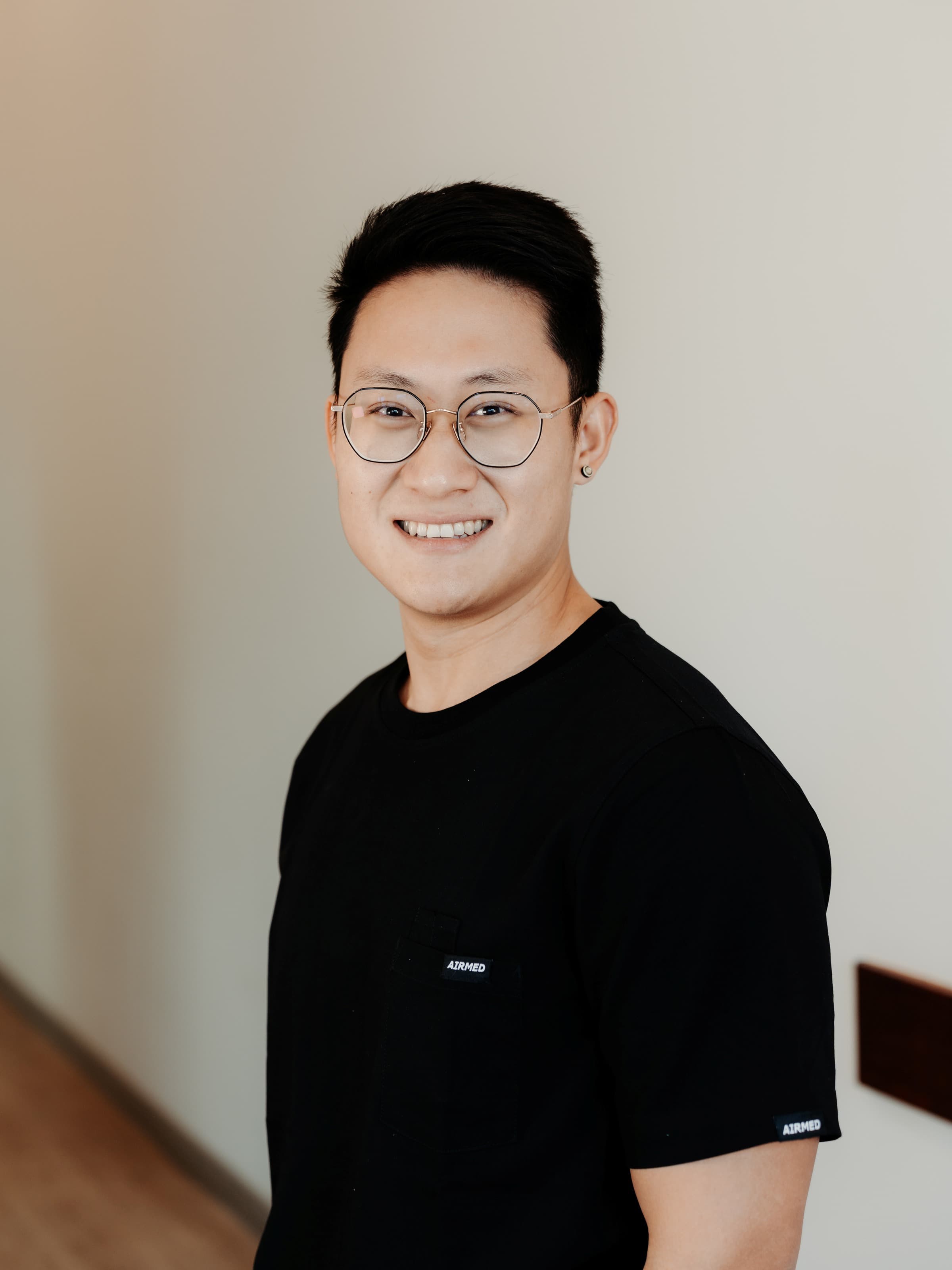 Dr Vince Wen, Principal Dentist at Joyner Family Dental, in a professional headshot with a warm smile