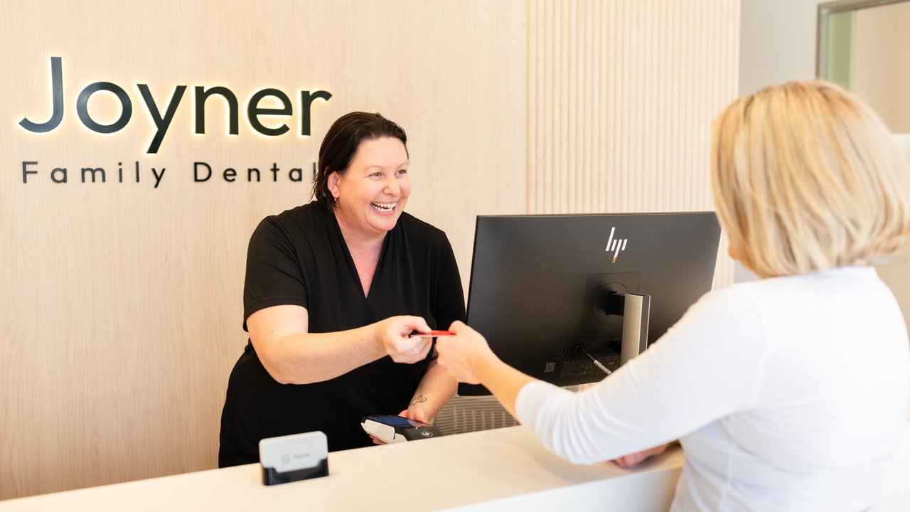 Dentist explaining emergency dental options on a tablet