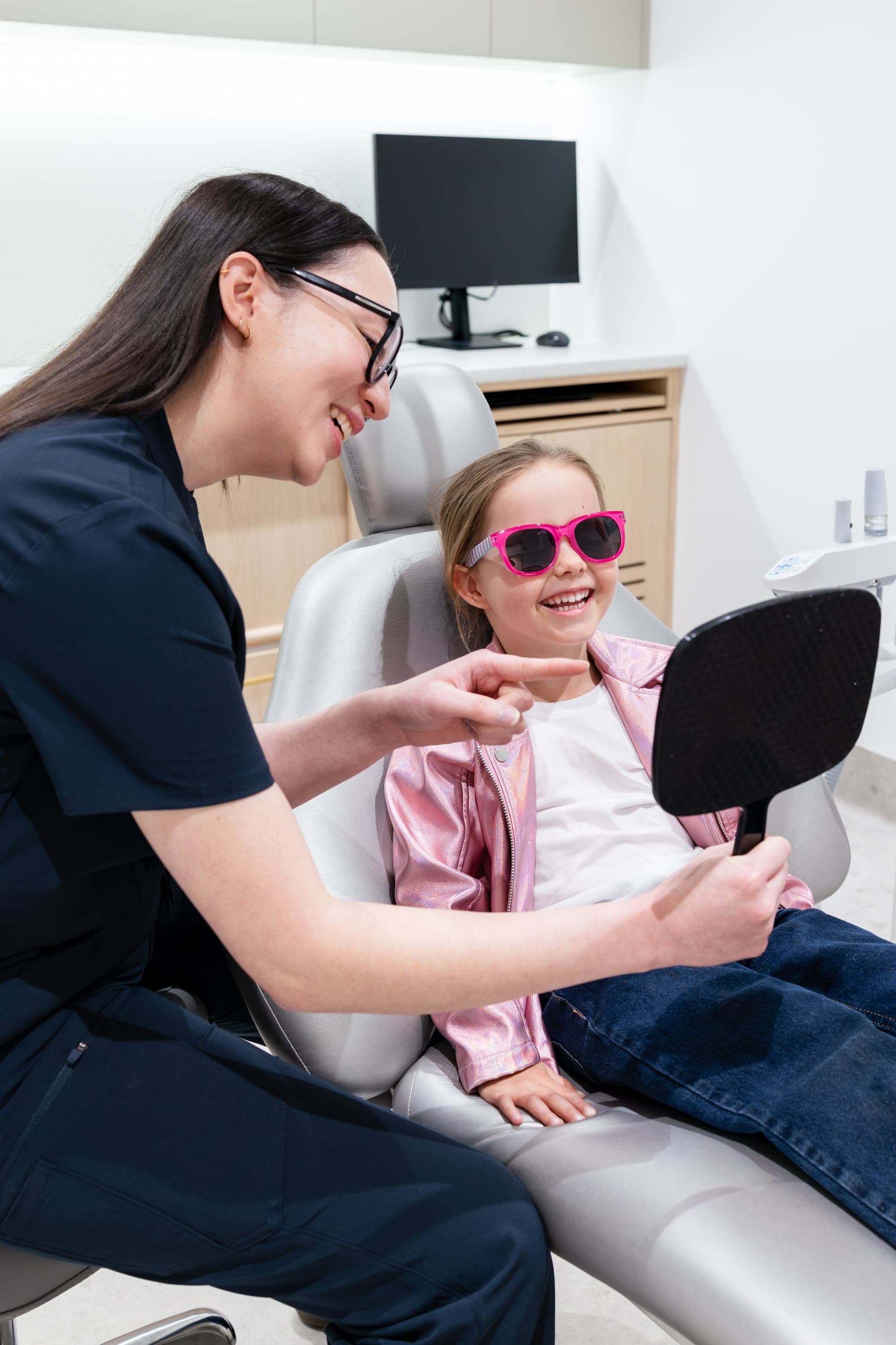 Dentist reviewing digital assessment findings with a patient