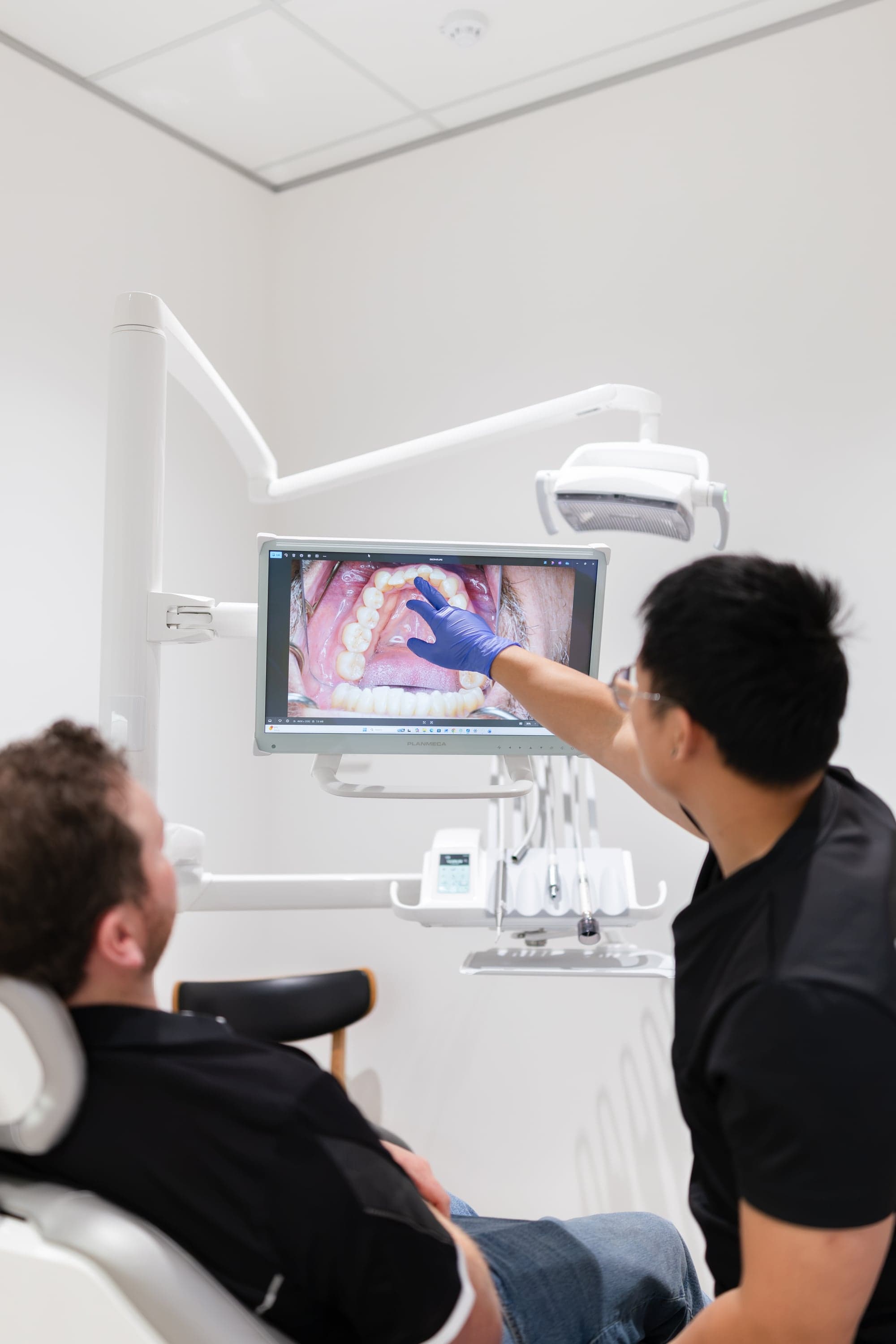Dentist providing treatment with a personalised plan at Joyner Family Dental
